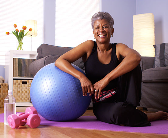 woman sits happy after exercising